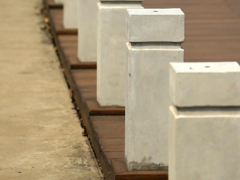 Concrete bollards serving as a pedestrian safety barrier