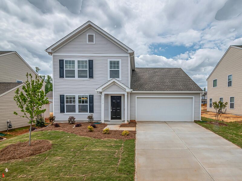 Large two-story home with new siding installation